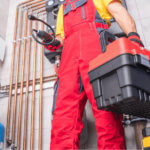 HVAC technician with red toolbox