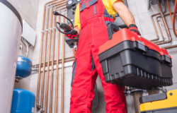 HVAC technician with red toolbox