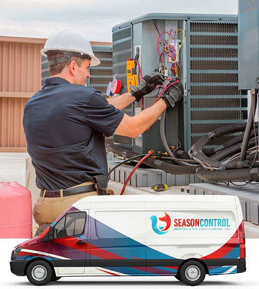 Man working on equipment behind Season Control van